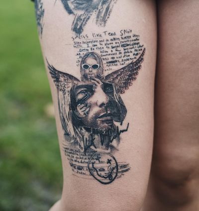Realistic portrayal of the Nirvana frontman with iconic elements like gun, wings, and cigarette by tattoo artist Gabriele Edu.