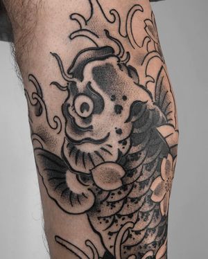 Experience the mesmerizing beauty of traditional Japanese koi fish in intricate blackwork and dotwork style by FKM TATTOO.