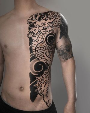 Get a fierce blackwork Japanese dragon chest tattoo by FKM TATTOO for a bold and powerful look. Perfect for tattoo enthusiasts!