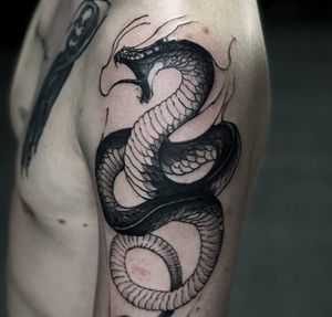 Snake done by @tavrov_tattoo (Gleb Tavrov)#traditional #blacktraditional