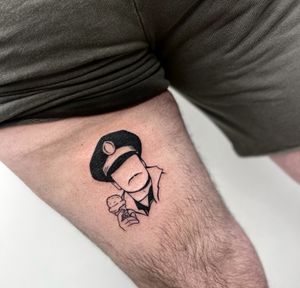 Unique blackwork tattoo of a police cap with ice cream, moustache, all in illustrative style on upper leg by Miss Vampira.