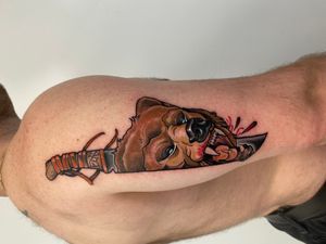 Get a stunning neo-traditional illustrative bear and knife tattoo on your upper arm by the talented Jethro Wood.