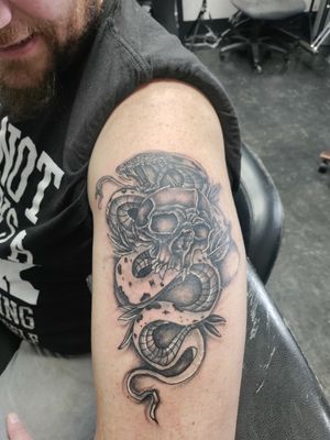 Snake and skull . Tattoo by tattoobyanthony at The Tattoo Shop in twin falls Idaho 