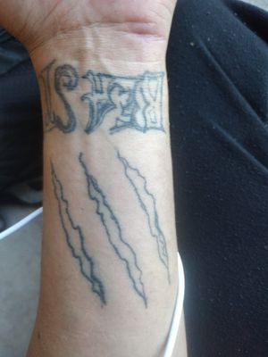 Help me fix my terrible tattoo for a reasonable price