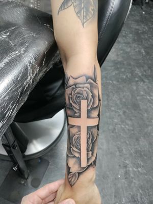 Rose and cross . Tattoo by tattoobyanthony at The Tattoo Shop in twin falls Idaho 