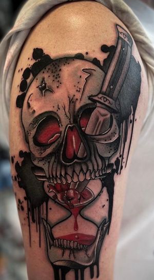 It's a skull with an hourglass and a heart pierced with a dagger.