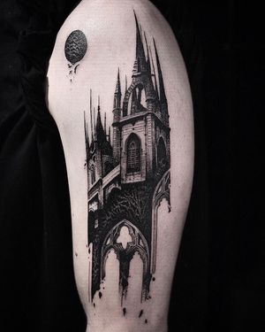 Elegant blackwork castle design on upper arm by Jamie B, perfect blend of architecture and artistry.