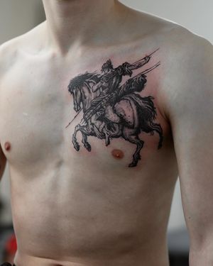 Illustrative blackwork chest tattoo of a majestic horse, artfully done by Jamie B.