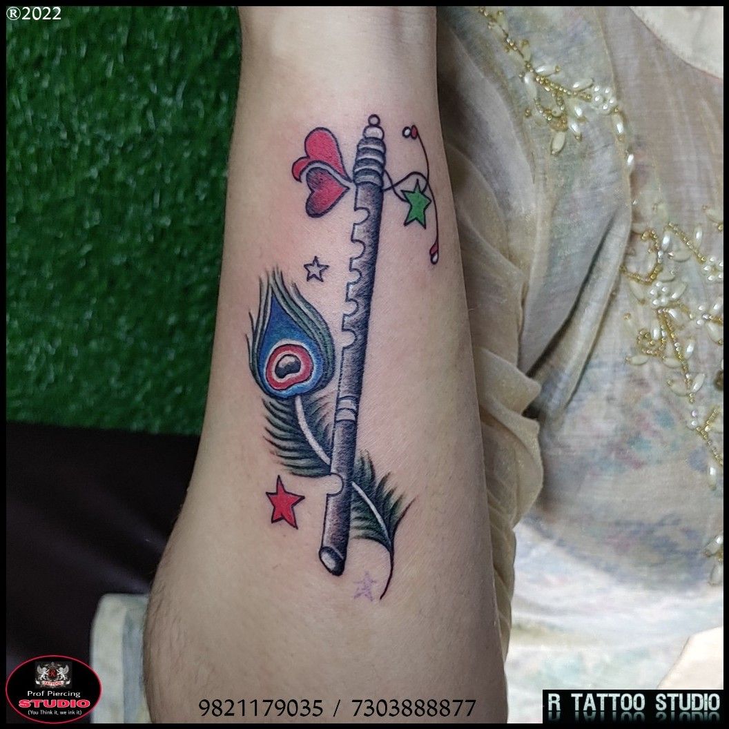 Tattoo uploaded by Rtattoo studio • Peacock feather tattoo Bansuri tattoo  #colourful #feather #tattoo# peacock #feather tattoo #Bansuri tattoo  #Krishna #bansuri tattoo Krishna #feather tattoo beautiful tattoo feather  tattoo • Tattoodo