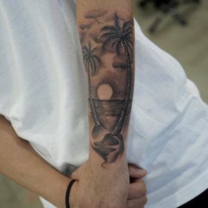 Capture the essence of a sunny day at the beach with this black and gray illustrative tattoo, perfect for your forearm. Located in Los Angeles, US.