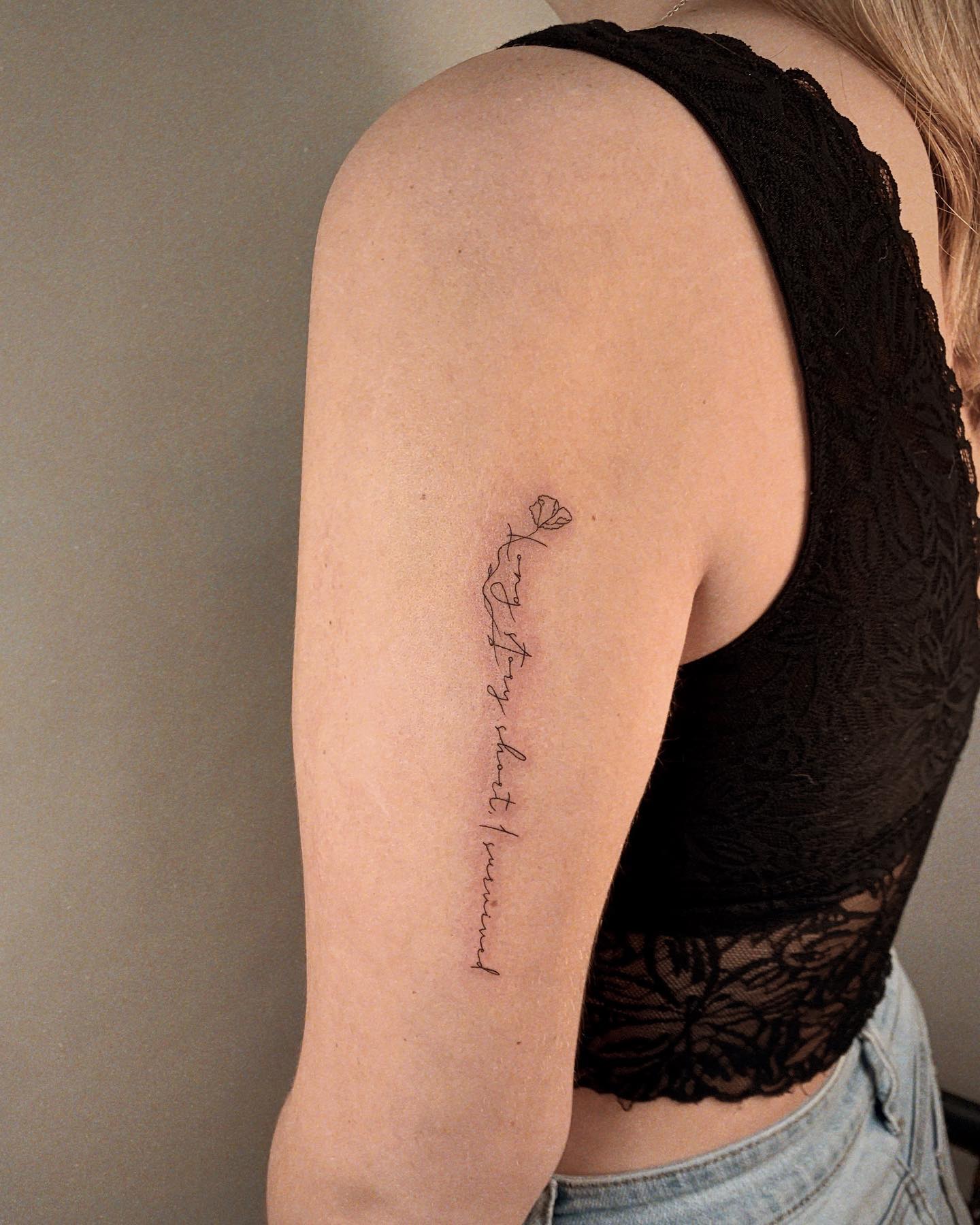 Un dia a la vez lettering tattoo handwritten on the