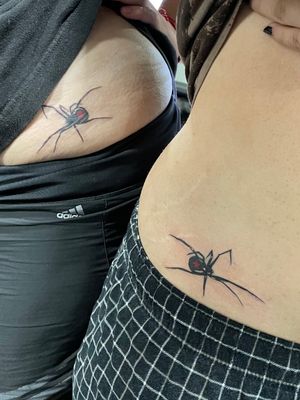 Matching spider tattoos 