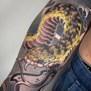 Get a stunning Japanese snake tattoo on your forearm in London, GB. Embrace the power and mystery of this ancient motif.