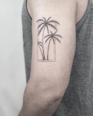 Elegant tree design on upper arm, beautifully executed with fine line technique by talented artist Lawrence.