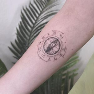 Polina's blackwork forearm tattoo featuring an illustrative watch and eye in fine line style. A captivating and unique design.