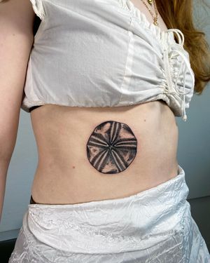Explore Sofia's blackwork style with this stunning fruit tattoo design on the ribs. Embrace the beauty of nature in this unique piece.