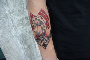 Sofia's skillfully inked anchor, ship, and flag design brings a timeless maritime touch to your forearm.