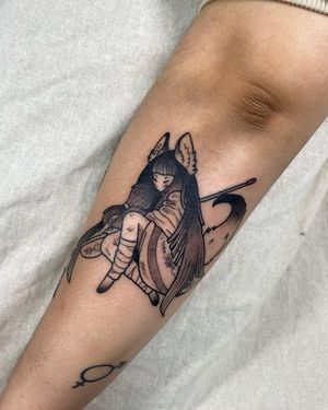 This illustrative tattoo by Sofia features a woman with a tail, beautifully crafted in blackwork style on the shin.