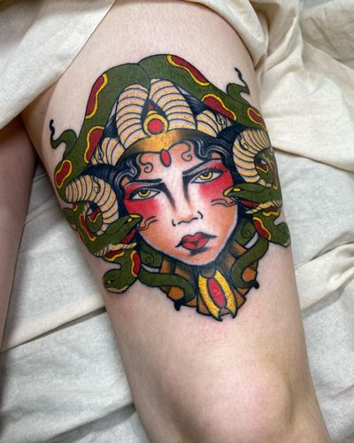 Experience Sofia's exquisite artistry with this neo-traditional tattoo featuring a bewitching medusa and serpent design on your upper leg.
