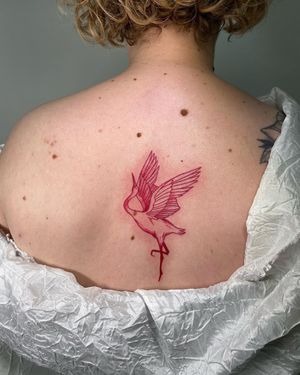 Admire the elegance of this illustrative heron tattoo on your back, created by the talented artist Sofia.