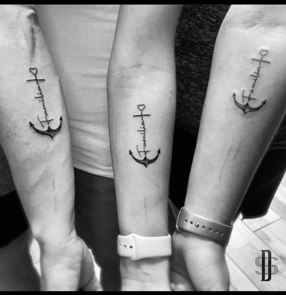 Matching family tattoo.