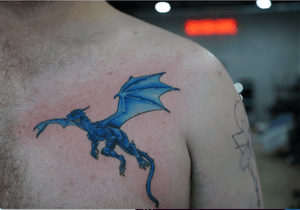 Get fierce with this illustrative dragon tattoo on your chest, crafted by the talented artist Kotaro.
