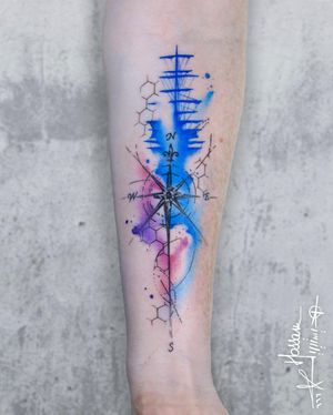 Get your unique compass and pattern forearm tattoo by artist Houssam in vibrant watercolor style. Stand out with this stunning design!