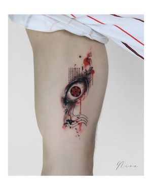 Bold blackwork and fine line illustrative tattoo on upper arm, featuring a captivating eye motif in trashpolka style.
