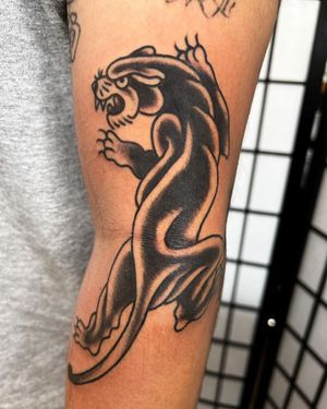 Get fierce with this illustrative panther tattoo by Andre Bertoncin. Perfect for an arm placement.