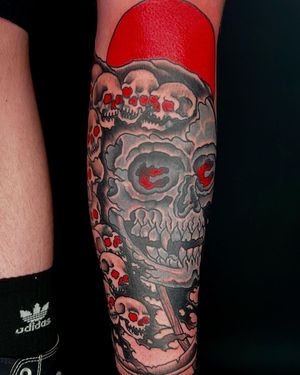 Unique blackwork design by tattoo artist Shawn Nutting, featuring a detailed skull motif on the shin.