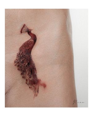 Experience the beauty of underwater world with a stunning fish tattoo by Nina. Perfect for your upper leg!