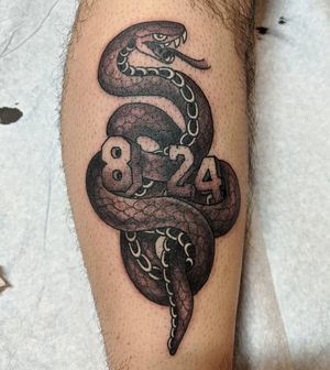 Illustrative blackwork snake tattoo on lower leg by Arlene Salinas, honoring the legend Kobe Bryant.