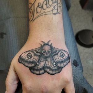 Unique blackwork illustration by Arlene Salinas combining the beauty of a moth with the edginess of a skull.