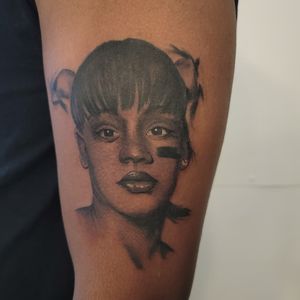 Capture the beauty of womanhood with this stunning upper arm tattoo. Arlene Salinas' impeccable realism and illustrative style bring this portrait to life.
