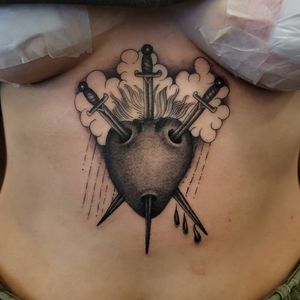 Experience the intensity of love and battle with this bold blackwork tattoo by Arlene Salinas on your upper back.