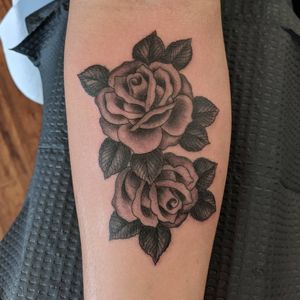 Get inked by Arlene Salinas with this stunning blackwork flower design on your forearm. Stand out with this unique piece of art.