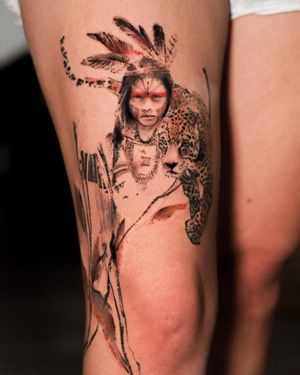 Blackwork tattoo by La Bottega dell'Arte featuring a realistic leopard and native patterned woman on upper leg.