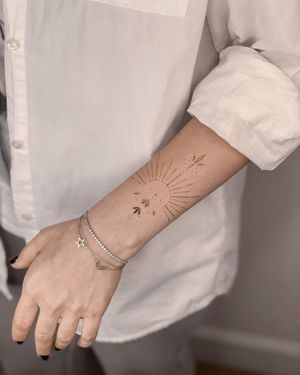 Elegant fine line and illustrative style tattoo by Nika Shvets with intricate mandala pattern design.