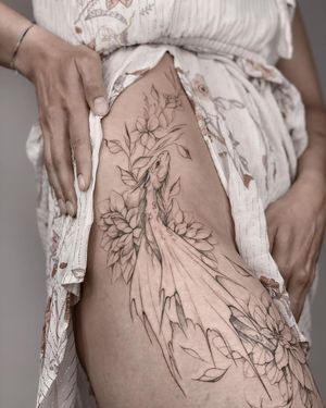 Elegant blackwork and fine line illustrative tattoo on upper leg by Nika Shvets, featuring a beautiful dragon and flower design.