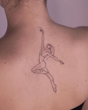 Elegant and detailed fine line tattoo of a woman on the upper back, created by the talented artist Osman Ergin.