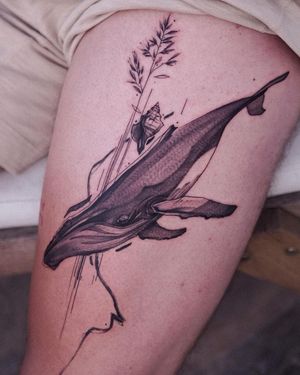 Unique blackwork and illustrative tattoo by Osman Ergin featuring a whale, flower, and intricate pattern design on the upper leg.