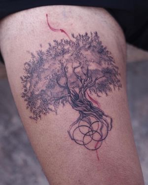 Striking blackwork design by Osman Ergin featuring a geometric tree pattern on the upper leg.