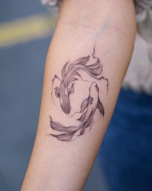 Get hooked on Osman Ergin's fine line blackwork fish tattoo, beautifully detailed and perfect for the forearm.