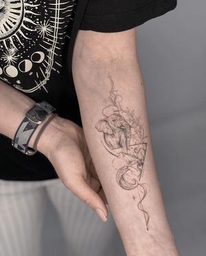 Geometric and illustrative forearm tattoo featuring a mountain, elephant, and triangle motif, created by Nika Shvets.