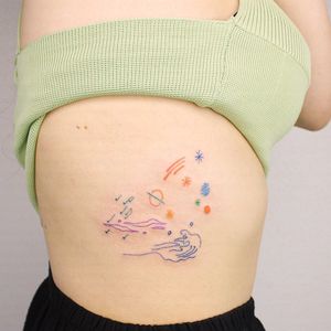 Capture the beauty of nature with this illustrative tattoo by Tuğçe özbıyık. Perfect for the rib area.