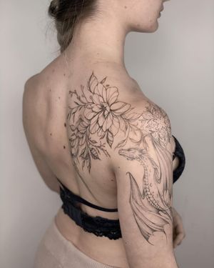 Blackwork fine line design by Nika Shvets, beautifully blending dragon, flower, and mandala motifs on the shoulder.