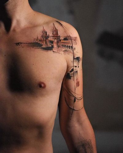 Unique blackwork tattoo of a building pattern on the shoulder, created by La Bottega dell'Arte.