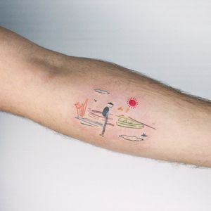 Beautiful illustrative tattoo featuring a sun, flower, and boat, skillfully done by Tuğçe özbıyık on the forearm.