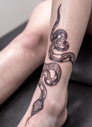 Snake wrap around tattoo 