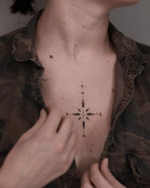 Adrian Mokijewski's detailed blackwork and dotwork design creates a striking illustrative pattern on the chest.